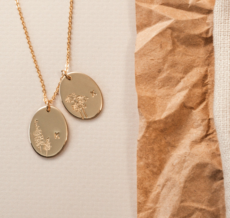 Personalised jewellery – handmade jewellery – KBN jewellery – Australian made jewellery – initial necklace – birth flower necklace – single pendant necklace with flower – birth flower necklace custom – custom birth month necklace – birth flower necklace with initial – oval pendant necklace – flower stamped necklace