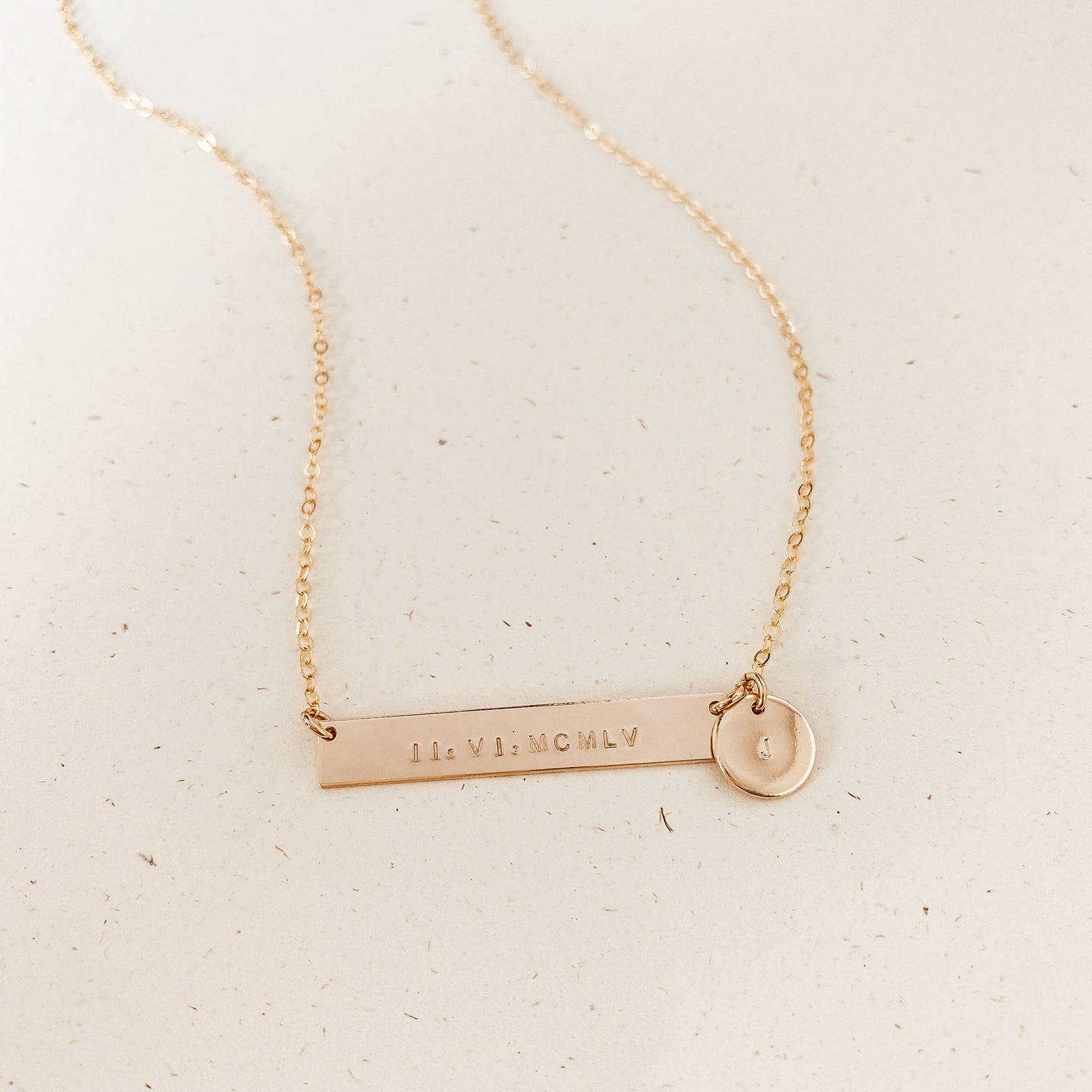 Personalised jewellery - KBN Jewellery - handmade jewellery – Personalised Jewellery gifts – Dainty jewellery- bar necklace – dainty bar necklace – personalised date necklace – roman numerals necklace – name bar necklace – words of affirmation necklace – long bar necklace – layering necklace – layering necklace inspiration – wedding gift idea – wedding gift idea for bride  - long pendant necklace with additional small pendant – unique necklace – personalised bar necklace