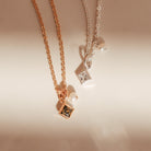 Two necklaces with square pendants on a light background - KBN Jewellery - Birthstone Necklace - Pearl Necklace