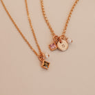 Two necklaces with square pendants on a light background - KBN Jewellery - Birthstone Necklace - Pearl Necklace