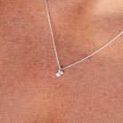 Two necklaces with square pendants on a light background - KBN Jewellery - Birthstone Necklace - Pearl Necklace
