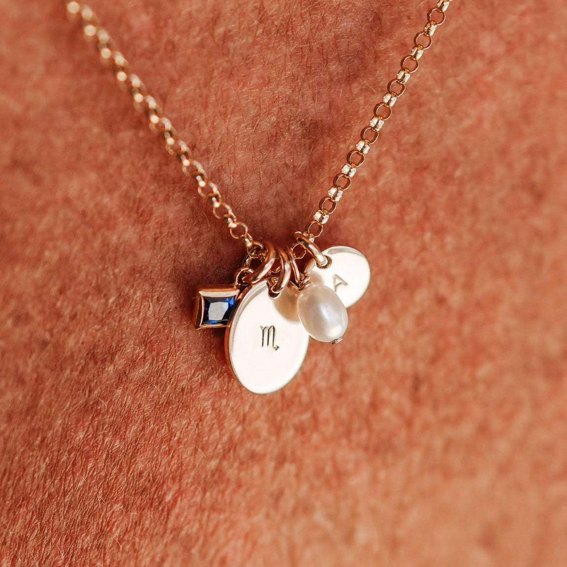 Necklace with charms on a person's skin - birthstone cluster necklace- personalised initial necklace - kbn jewellery