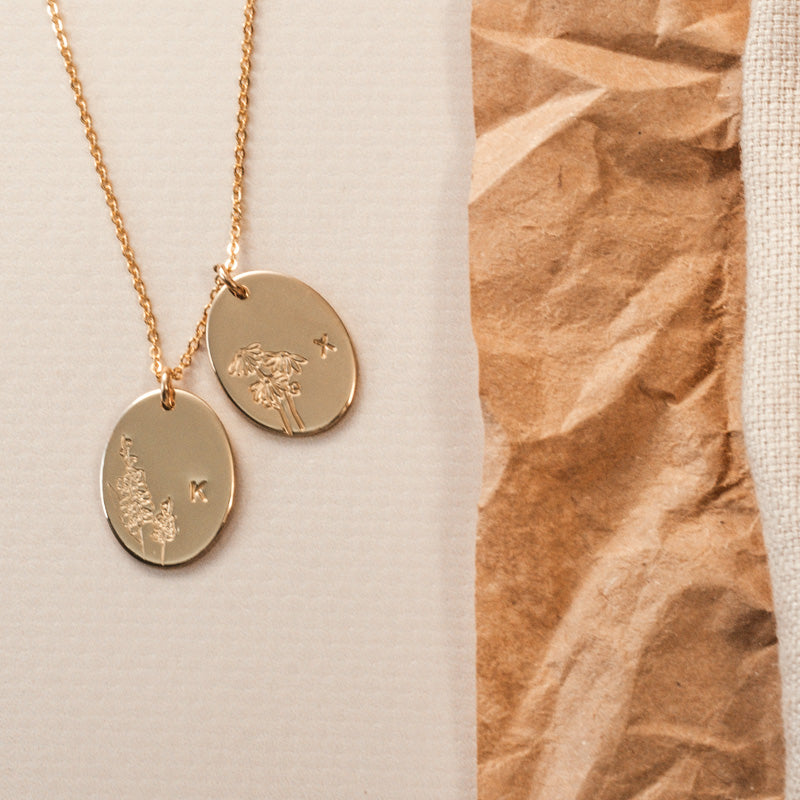 Personalised jewellery – handmade jewellery – KBN jewellery – Australian made jewellery – initial necklace – birth flower necklace – single pendant necklace with flower – birth flower necklace custom – custom birth month necklace – birth flower necklace with initial – oval pendant necklace – flower stamped necklace